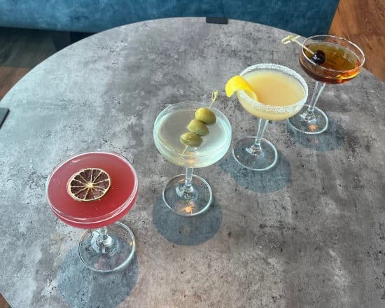 martini lineup of Cosmopolitan, Classic Martini, Lemon Drop and Manhattan