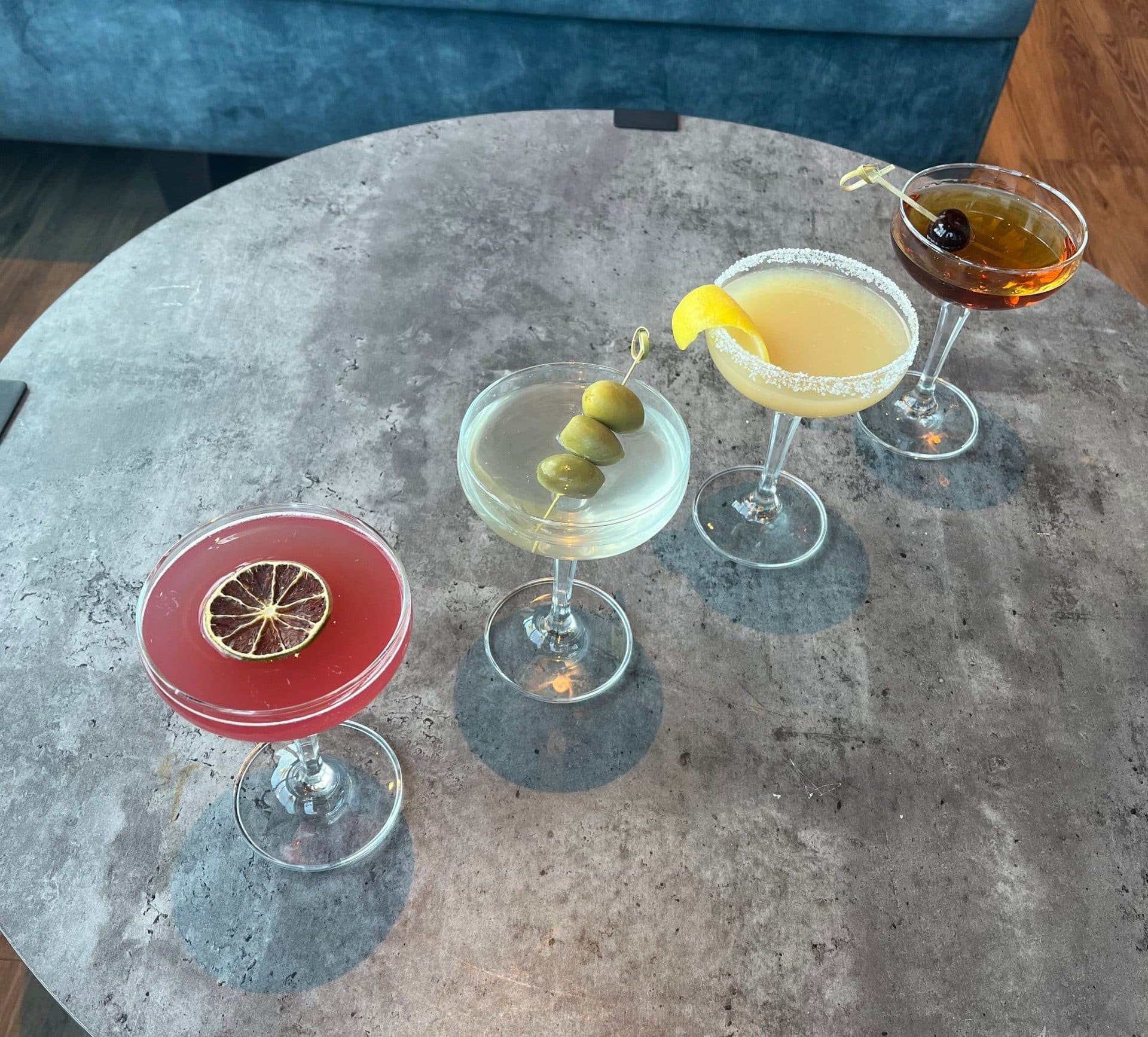 martini lineup of Cosmopolitan, Classic Martini, Lemon Drop and Manhattan
